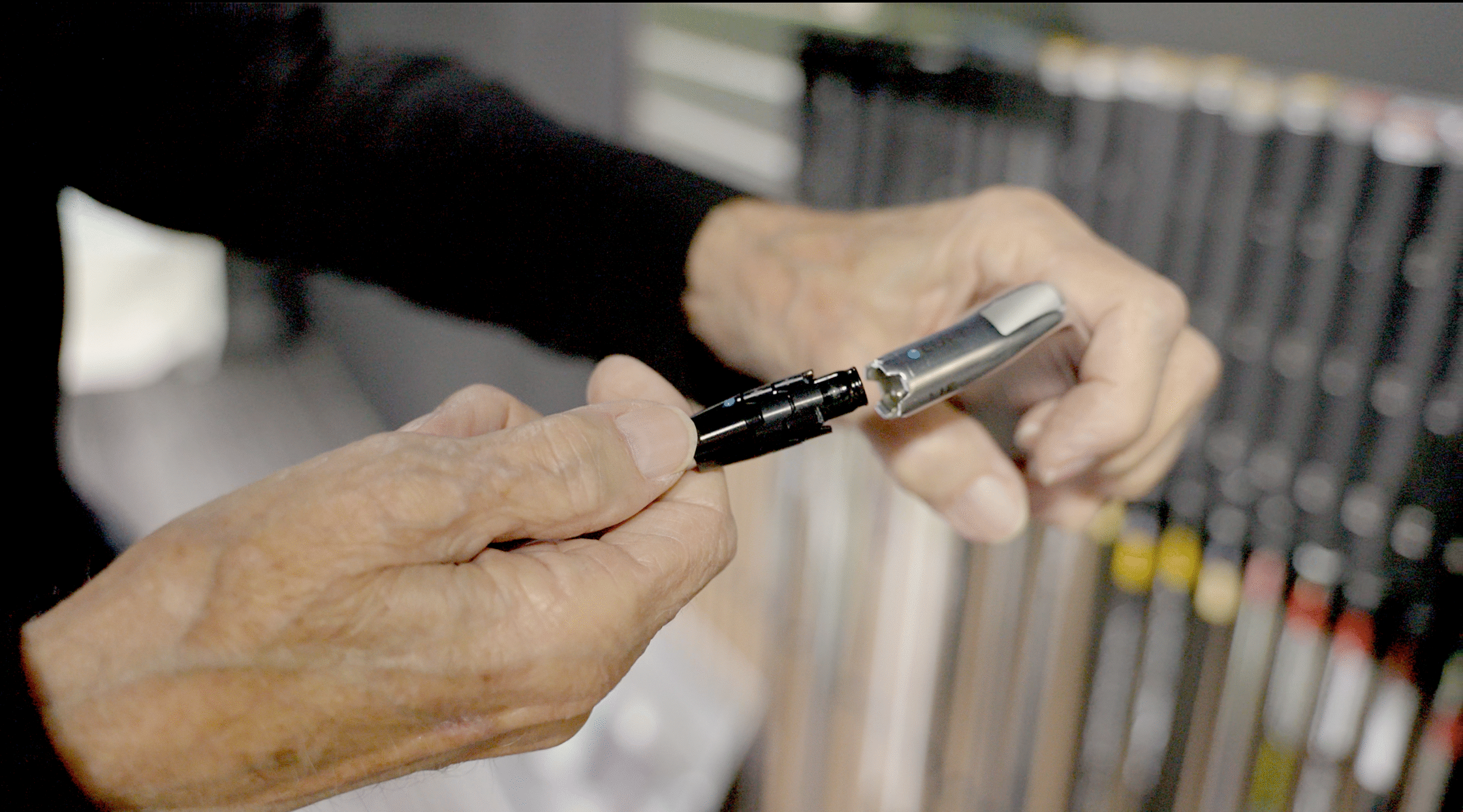 Lago Golf club fitter assembling an iron head and shaft during a custom club fitting in Port Coquitlam, BC