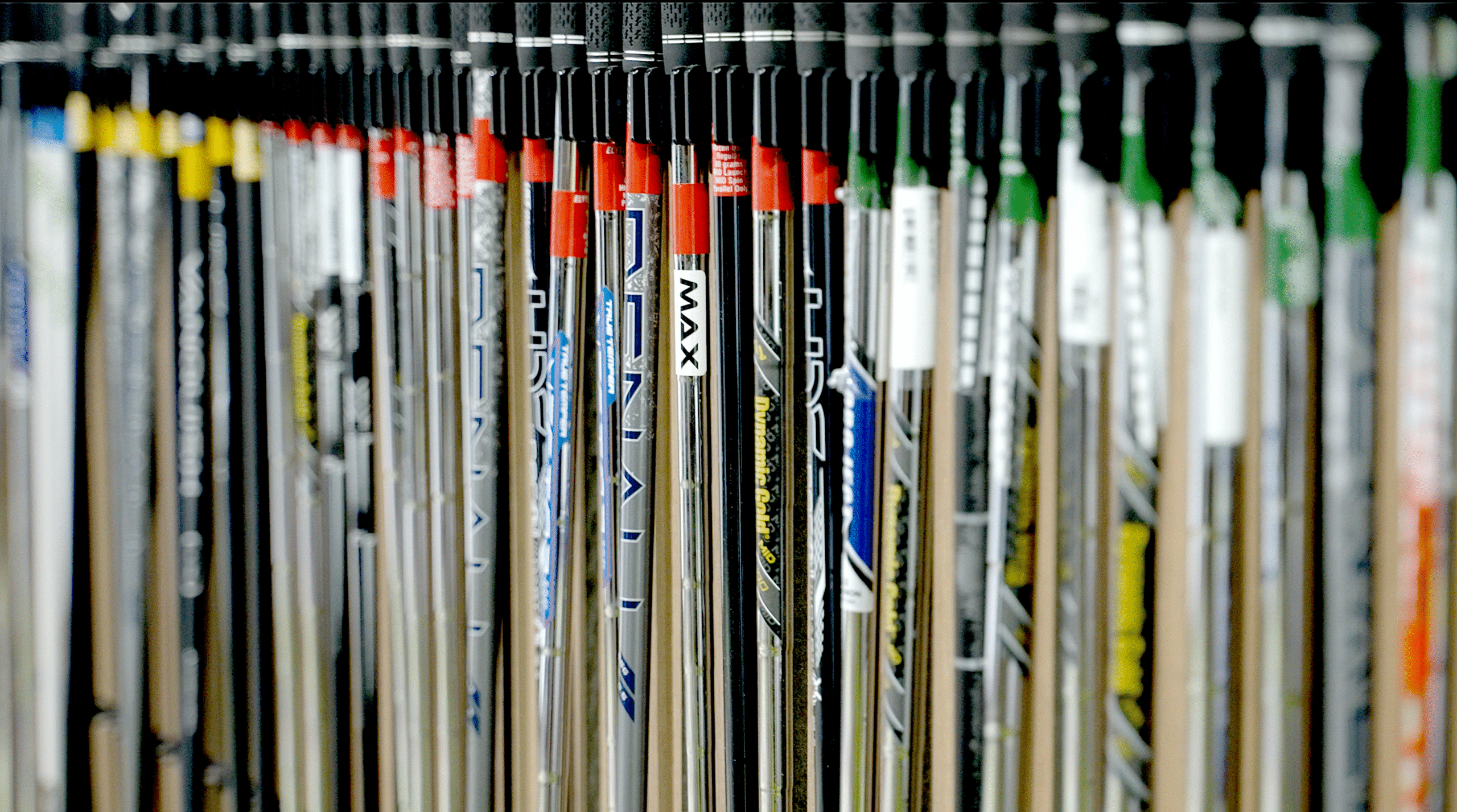 Selection of iron and driver shafts prepared for custom club fitting at Lago Golf in Port Coquitlam, BC