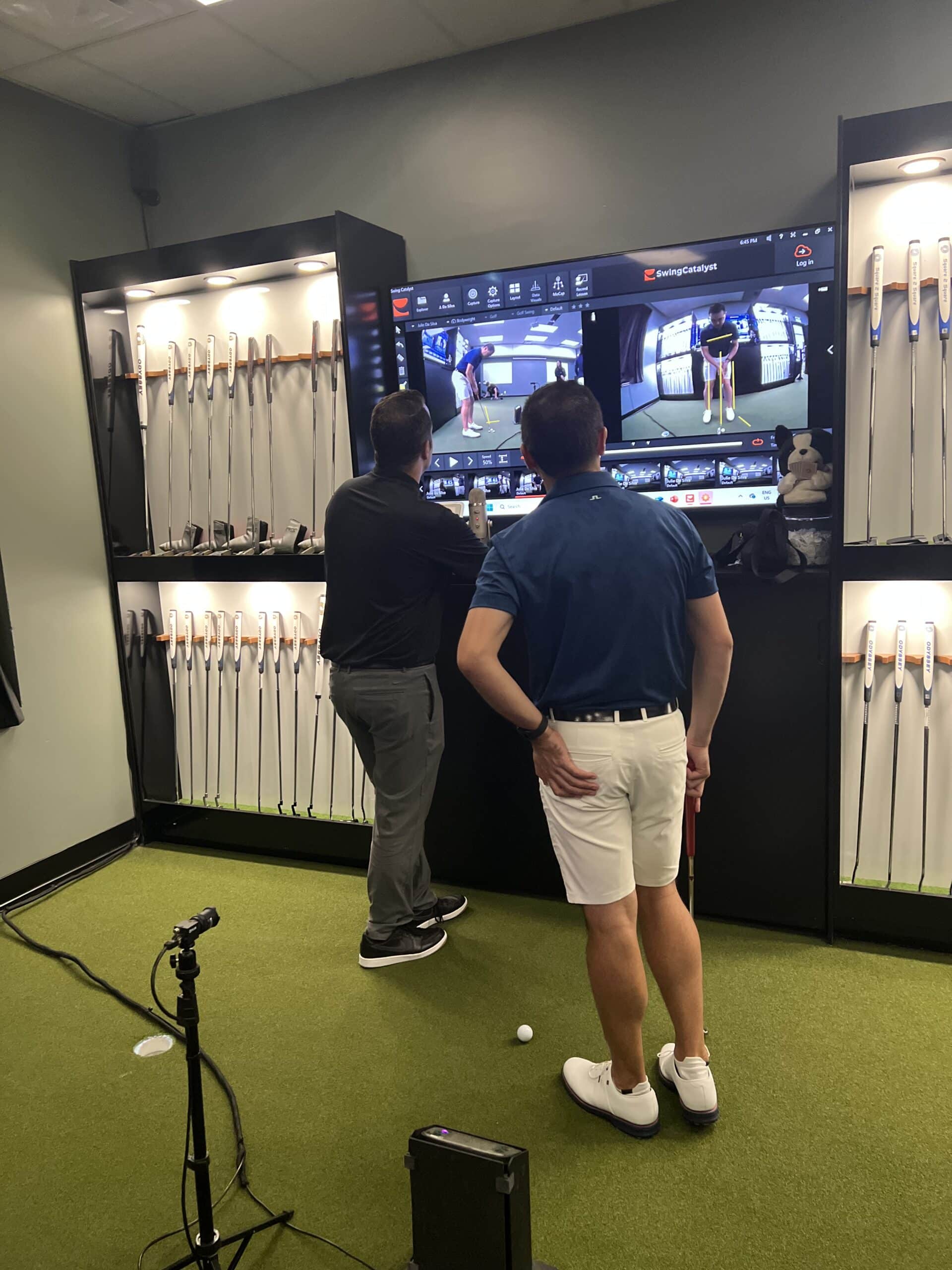 adult getting a putter fitting at lago golf putting studio in port coquitlam