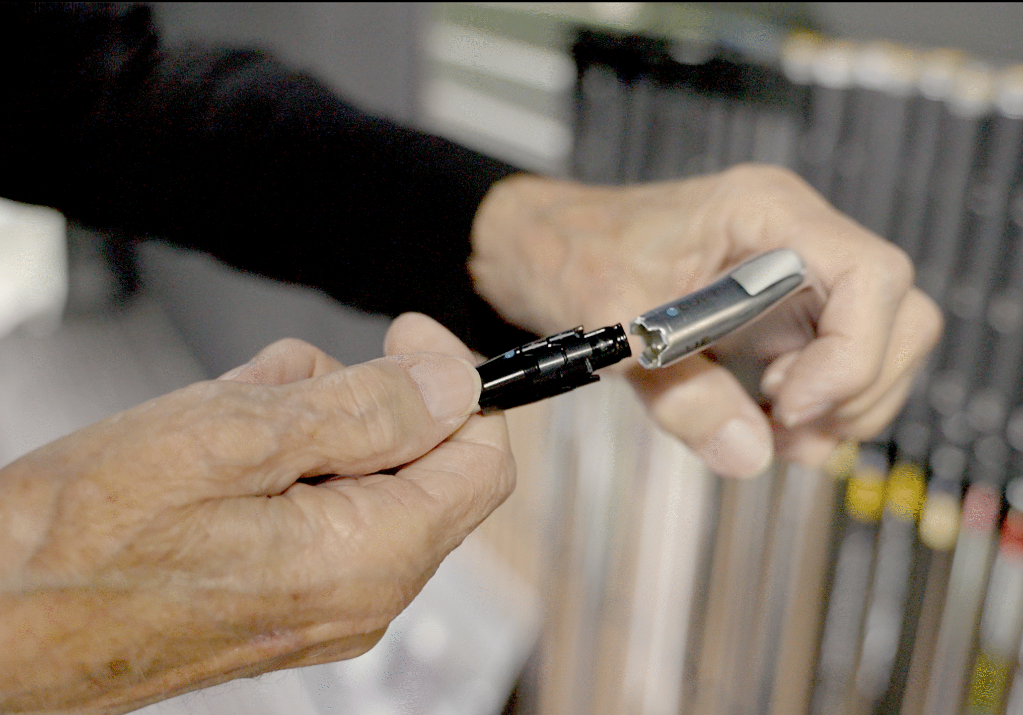 Lago Golf club fitter assembling an iron head and shaft during a custom club fitting in Port Coquitlam, BC
