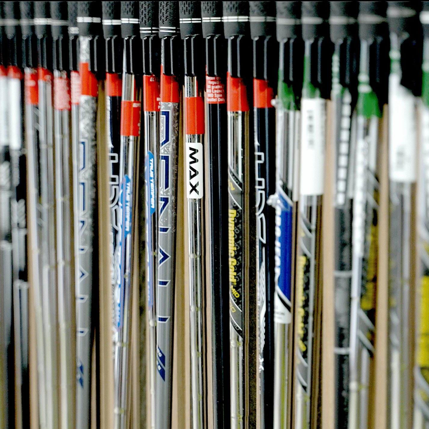 Selection of iron and driver shafts prepared for custom club fitting at Lago Golf in Port Coquitlam, BC
