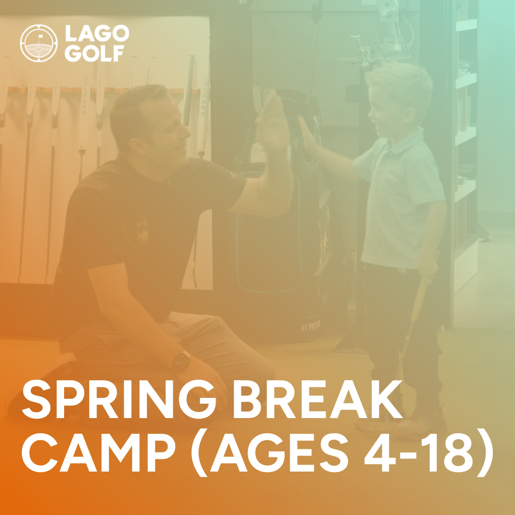 Junior at Lago Golf Spring Break Camp high-fiving a coach after making a putt in the putting studio (Port Coquitlam)